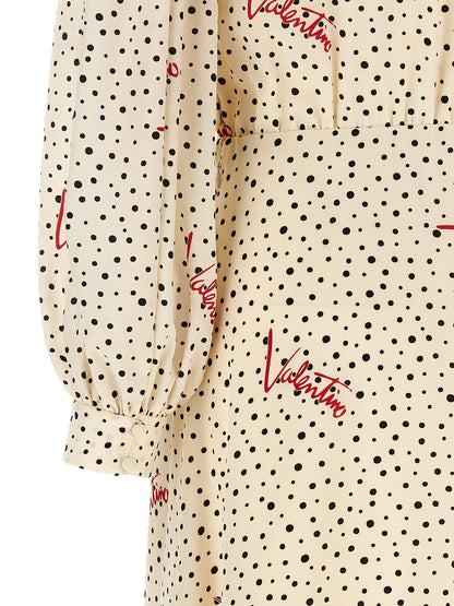 Dress by Valentino Garavani for women in silk black, ivory, multicolor, red, dots & print features a dramatic silhouette, showcasing an elegant and that flows into a dramatic midi.