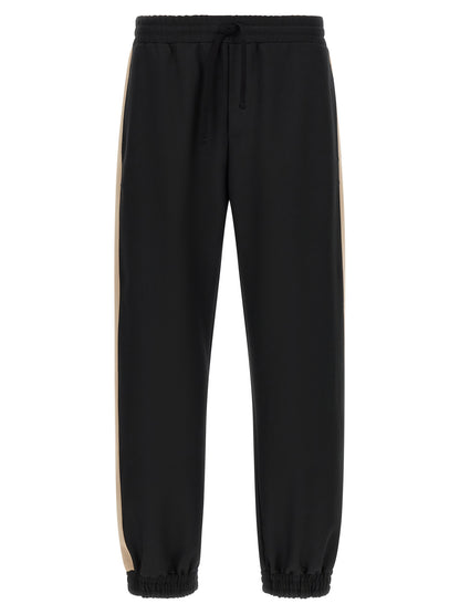 Joggers by Valentino Garavani for men in polyester black & gold features a refined silhouette with a refined athletic, defined by a and a refined long for a refined finish.