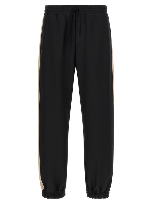 Joggers by Valentino Garavani for men in polyester black & gold features a refined silhouette with a refined athletic, defined by a and a refined long for a refined finish.
