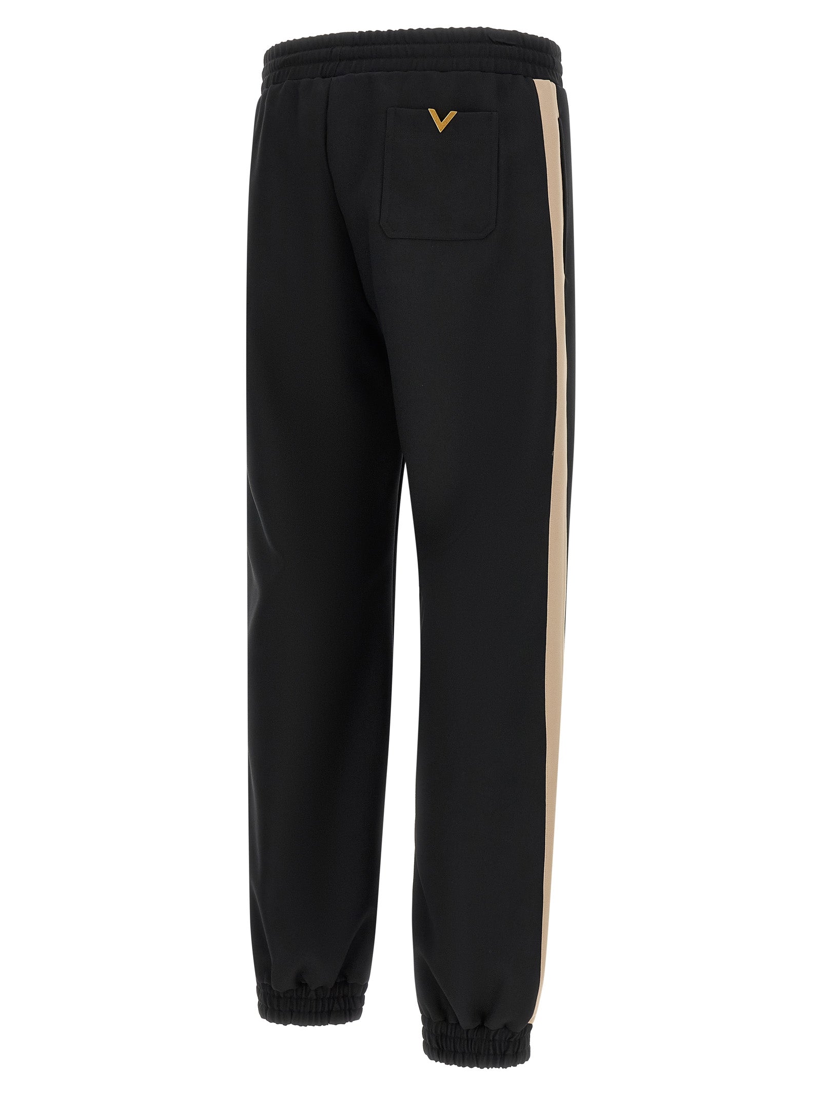 Joggers by Valentino Garavani for men in polyester black & gold features a polished silhouette with a polished athletic, reaching a polished long and finished with a polished .
