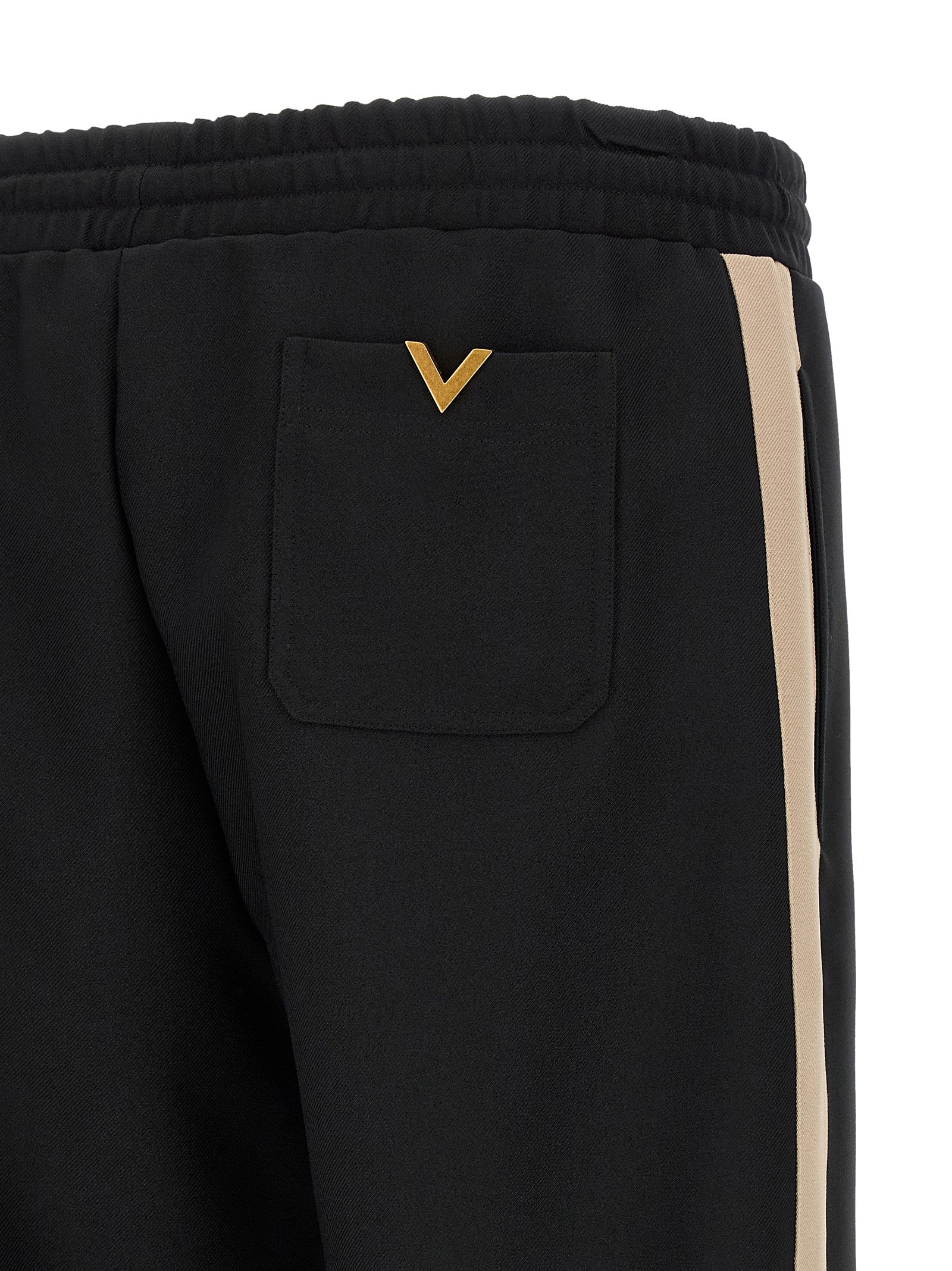 Joggers by Valentino Garavani for men in polyester black & gold features an sophisticated and athletic with a precise long, creating a sophisticated and sophisticated silhouette.