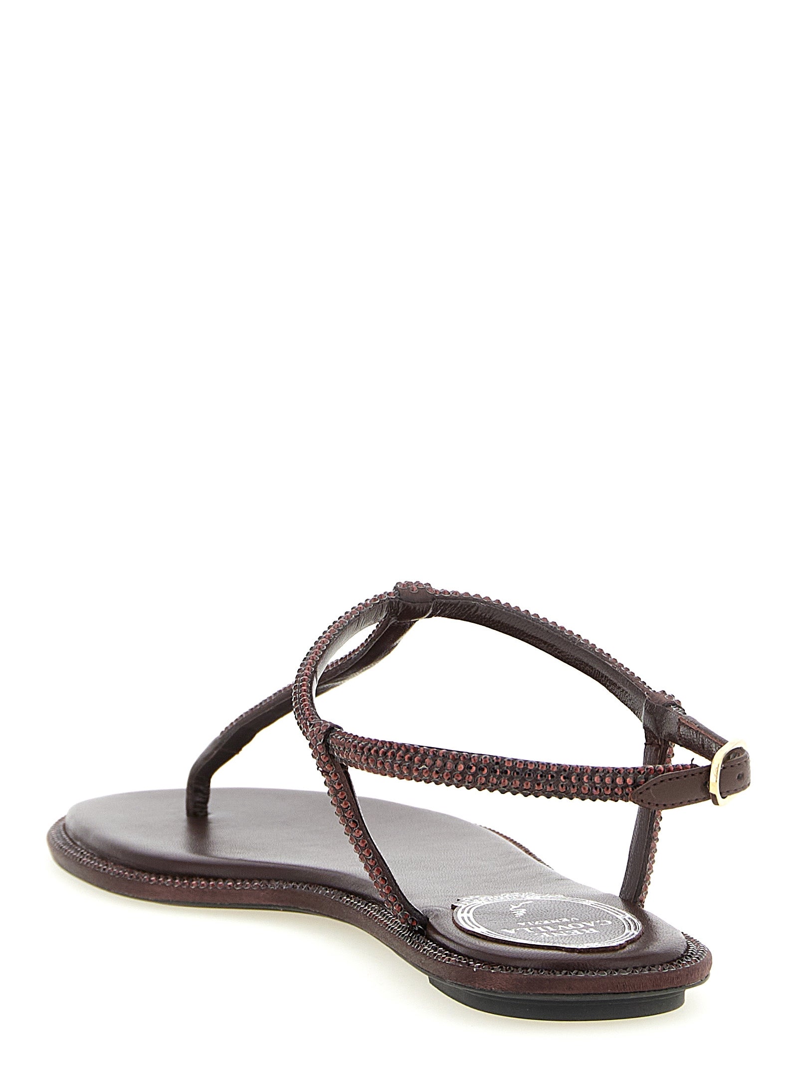 Flat Flip-Flop Sandals by RENE CAOVILLA for women in viscose leather & rhinestone brown presents a sculptural silhouette, showcasing the Aren Women's Viscose Leather & Rhinestone Flat Flip-Flop Sandals design with a sculptural flat and for a premium look.
