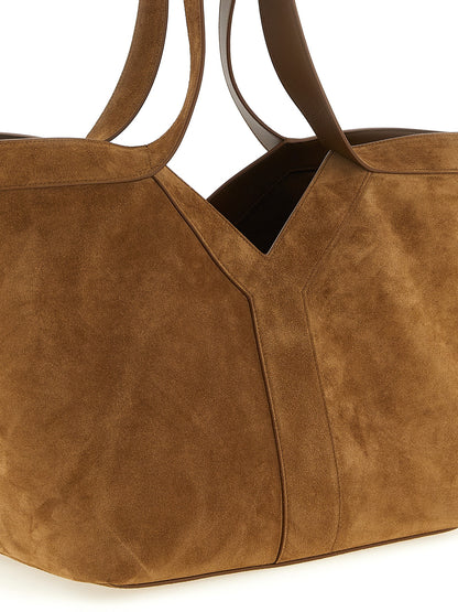 Small Tote Bag by Saint Laurent for women in plush suede calfskin leather brown & signature features an metropolitan chic Plush Suede Calfskin Leather Small Tote Bag design with a secure snap & hook, metropolitan chic , and versatile handle for a metropolitan chic look.