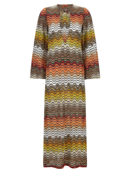 Dress by Missoni for women in viscose multicolor & patterned features a dramatic silhouette, showcasing an elegant v-neck neckline and long-sleeve that flows into a dramatic long.