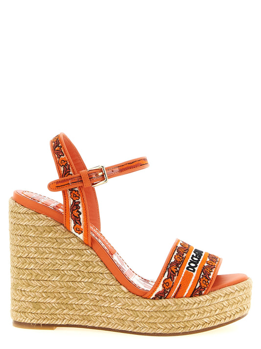 Wedge Ankle Strap Sandals by Dolce & Gabbana for women in lamb leather & cotton orange & patterned showcases a sculptural silhouette as Maiolica Women's Lamb Leather & Cotton Wedge Ankle Strap Sandals, defined by a sculptural wedge and sculptural for a sculptural look.