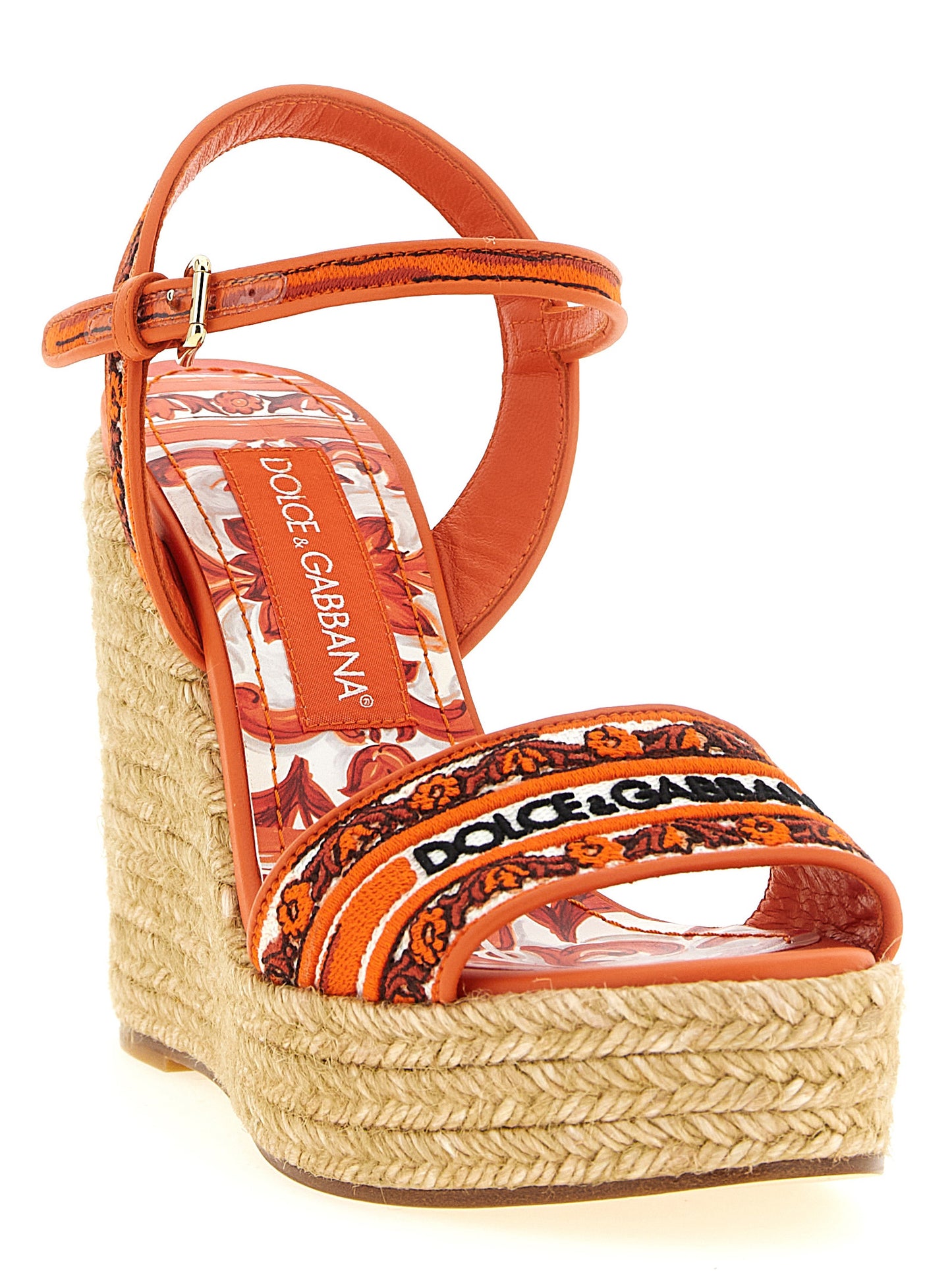Wedge Ankle Strap Sandals by Dolce & Gabbana for women in lamb leather & cotton orange & patterned features an architectural design from the Maiolica Women's Lamb Leather & Cotton Wedge Ankle Strap Sandals collection, defined by a architectural wedge and for a architectural finish.
