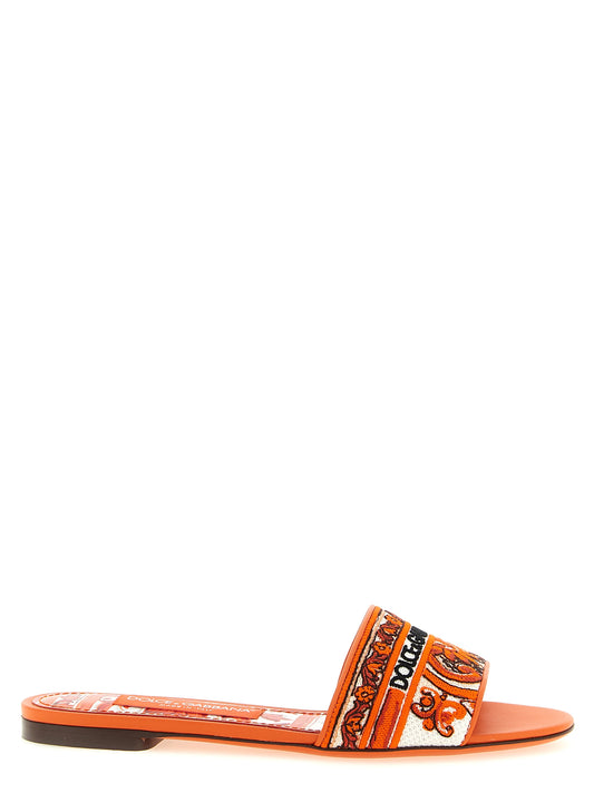 Sliders Flat Shoes by Dolce & Gabbana for women in lamb leather & cotton orange features an statuesque silhouette from the Maiolica Women's Lamb Leather & Cotton Sliders Flat Shoes collection, showcasing a and a statuesque for a statuesque look.