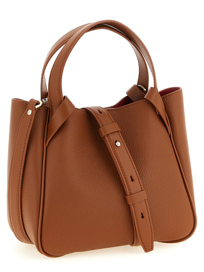 Mini Shopper Tote Bag by Christian Louboutin for women in bos taurus calfskin leather brown & red features an metropolitan chic Bettina Bos Taurus Calfskin Leather Mini Shopper Tote Bag design with a secure magnetic, metropolitan chic , and versatile shoulder-strap, adjustable-strap & handle for a metropolitan chic look.