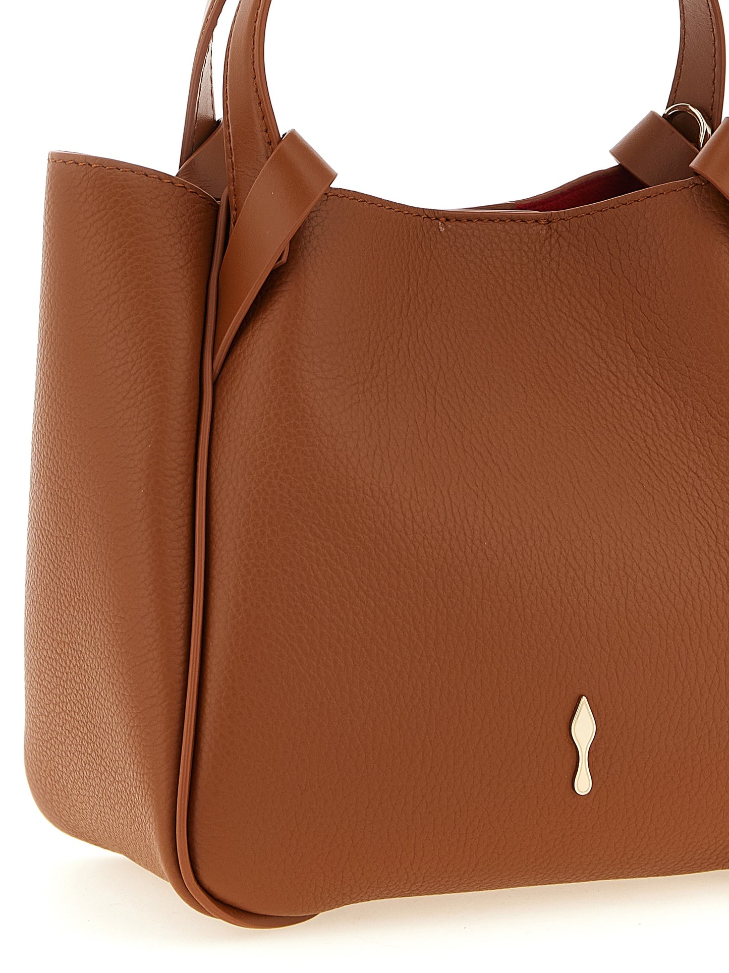 Mini Shopper Tote Bag by Christian Louboutin for women in bos taurus calfskin leather brown & red showcases a urban-chic Bettina Bos Taurus Calfskin Leather Mini Shopper Tote Bag design, featuring a secure magnetic, ample , and versatile shoulder-strap, adjustable-strap & handle for a urban-chic finish.