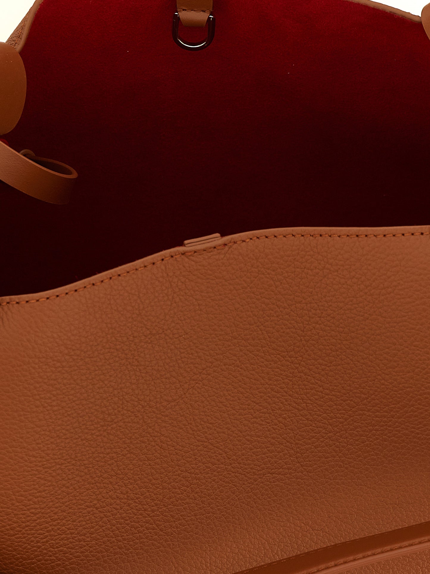This Small Shopper Tote Clutch Bag by Christian Louboutin for women in bos taurus calfskin leather brown features an on trend Bettina Bos Taurus Calfskin Leather Small Shopper Tote Clutch Bag design with a secure snap & hook, ample , and on trend handle.