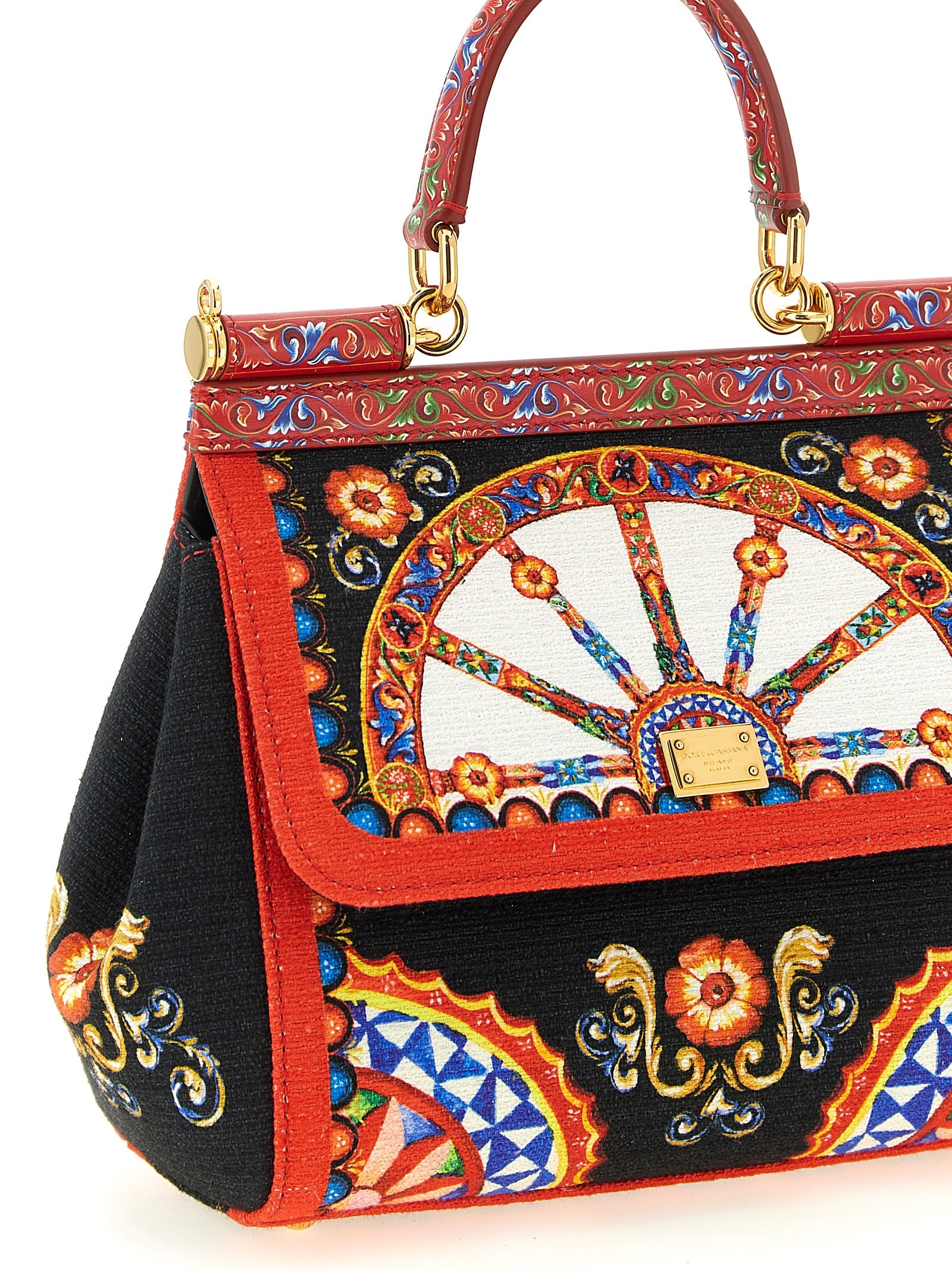 This Flap Handbag by Dolce & Gabbana for women in stretch cotton canvas linen & viscose and multicolor & print presents a sculptural silhouette featuring a secure snap & flap, ample , and versatile shoulder-strap, handle & adjustable-strap for a sculptural finish.