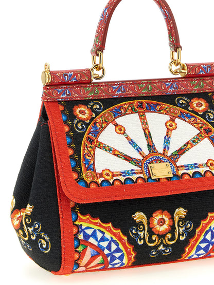 This Flap Handbag by Dolce & Gabbana for women in stretch cotton canvas linen & viscose and multicolor & print presents a sculptural silhouette featuring a secure snap & flap, ample , and versatile shoulder-strap, handle & adjustable-strap for a sculptural finish.