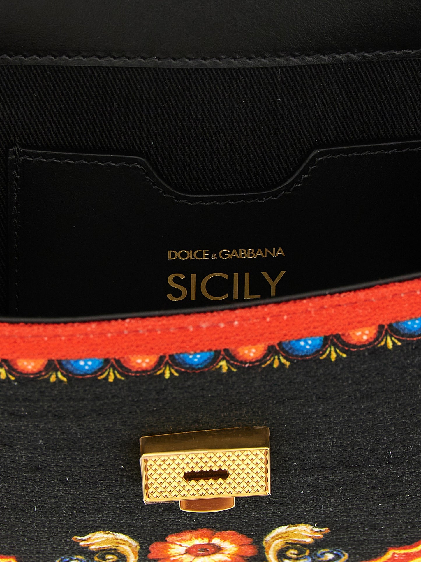 Flap Handbag by Dolce & Gabbana for women in stretch cotton canvas linen & viscose multicolor & print presents a ornamental silhouette, showcasing a secure snap & flap, ample , and versatile shoulder-strap, handle & adjustable-strap for a ornamental finish.