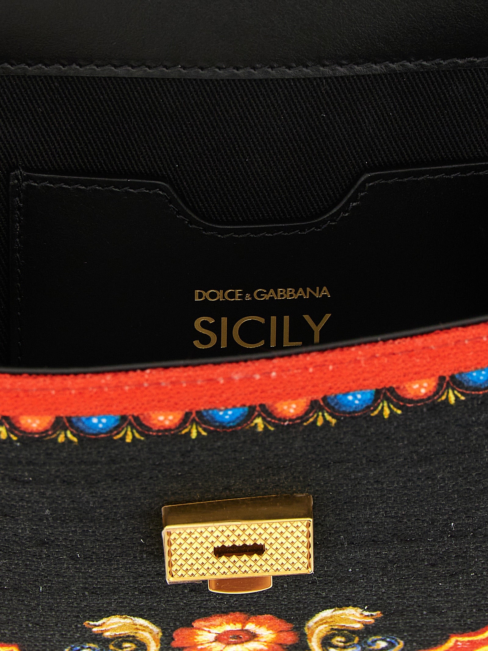 Flap Handbag by Dolce & Gabbana for women in stretch cotton canvas linen & viscose multicolor & print presents a ornamental silhouette, showcasing a secure snap & flap, ample , and versatile shoulder-strap, handle & adjustable-strap for a ornamental finish.