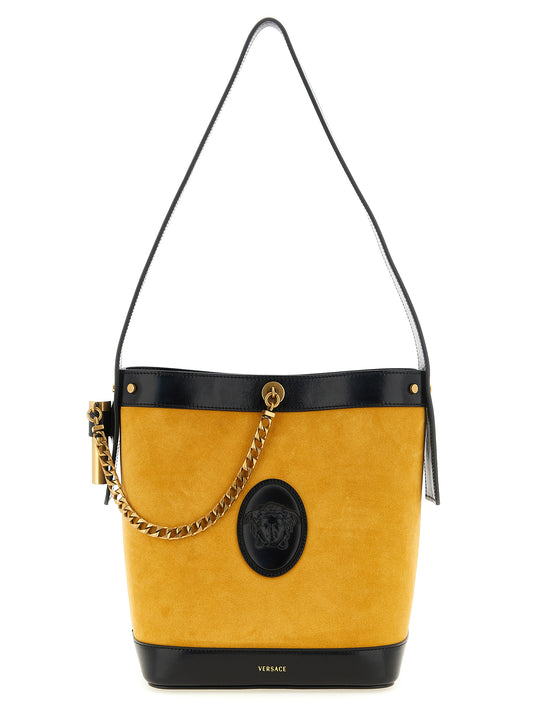 Small Bucket Shoulder Bag by Versace for women in calfskin leather bicolour & yellow features a effortless chic silhouette with a secure magnetic, ample , and versatile handle for a effortless chic finish.