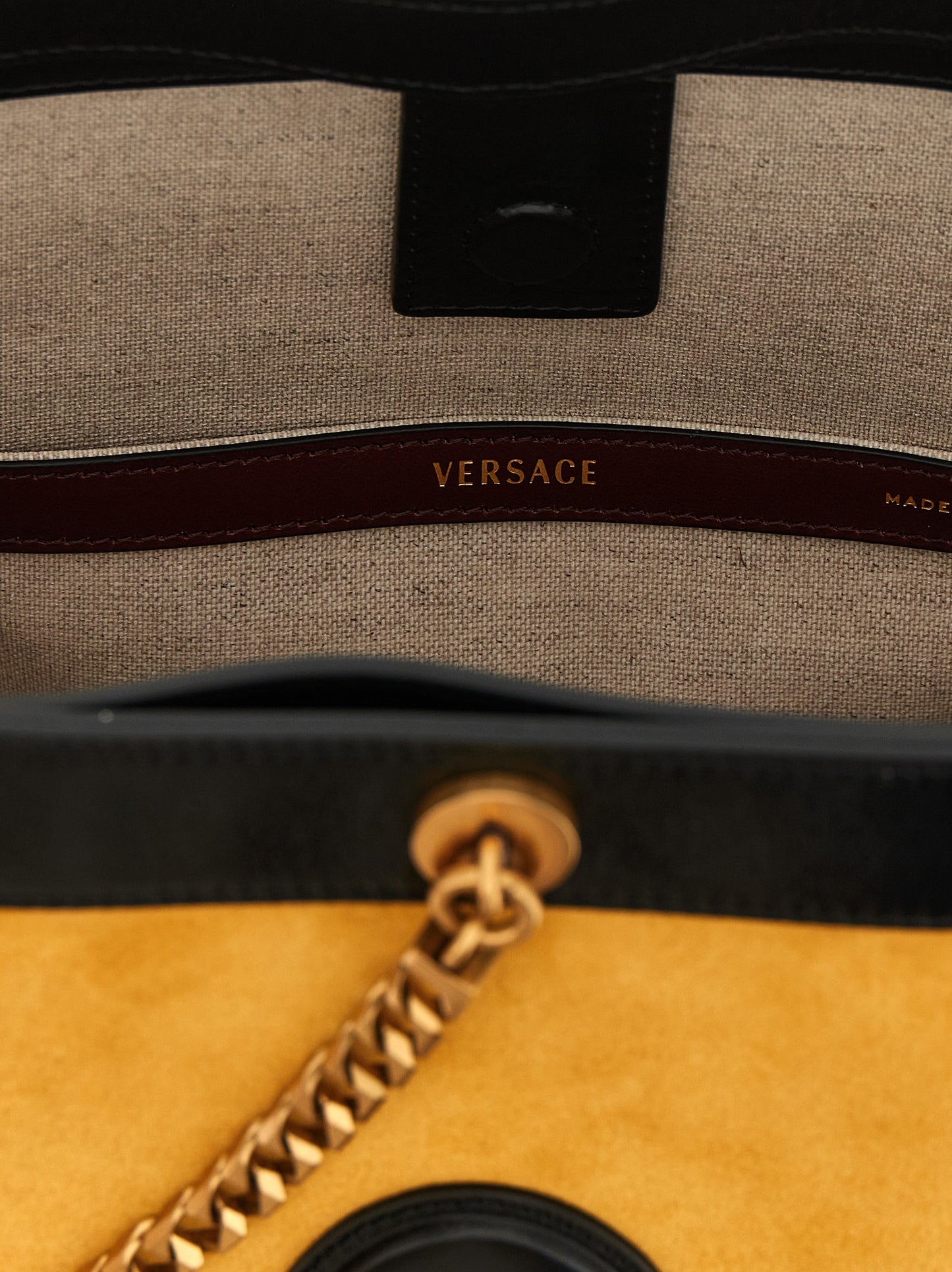 Small Bucket Shoulder Bag by Versace for women in calfskin leather bicolour & yellow features a effortless sophistication silhouette, secured by a magnetic with ample and versatile handle for a effortless sophistication finish.
