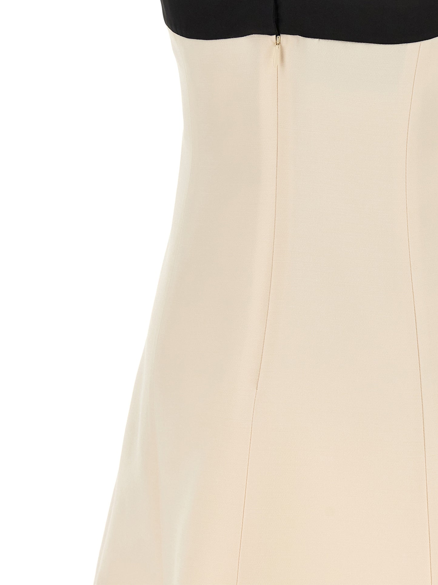 Dress by Valentino Garavani for women in silk crepe & virgin wool bicolour, black & white features a dramatic silhouette, showcasing an elegant and that flows into a dramatic short mini.