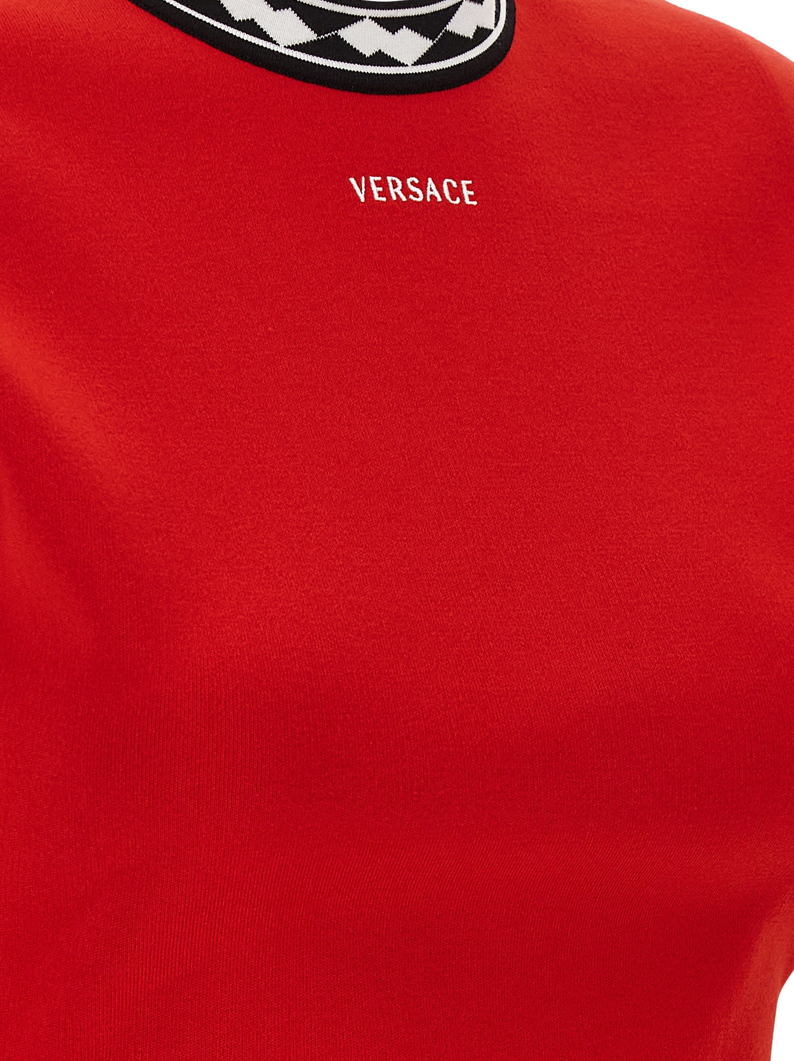Dress by Versace for women in cotton multicolor, red, patterned & jacquard features an magnificent silhouette, artfully detailed with a magnificent and that flows into an magnificent short mini.
