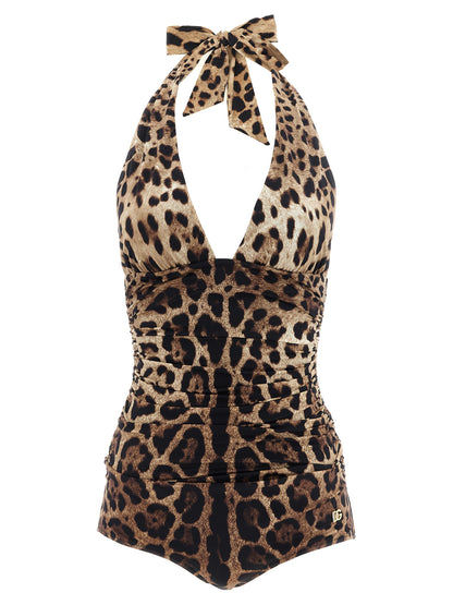 One-Piece Swimsuit by Dolce & Gabbana for women in stretch polyamide brown & print showcases a couture inspired silhouette from the Waves Women's Stretch Polyamide One-Piece Swimsuit collection, featuring a couture inspired cut designed for a couture inspired and couture inspired poolside look.