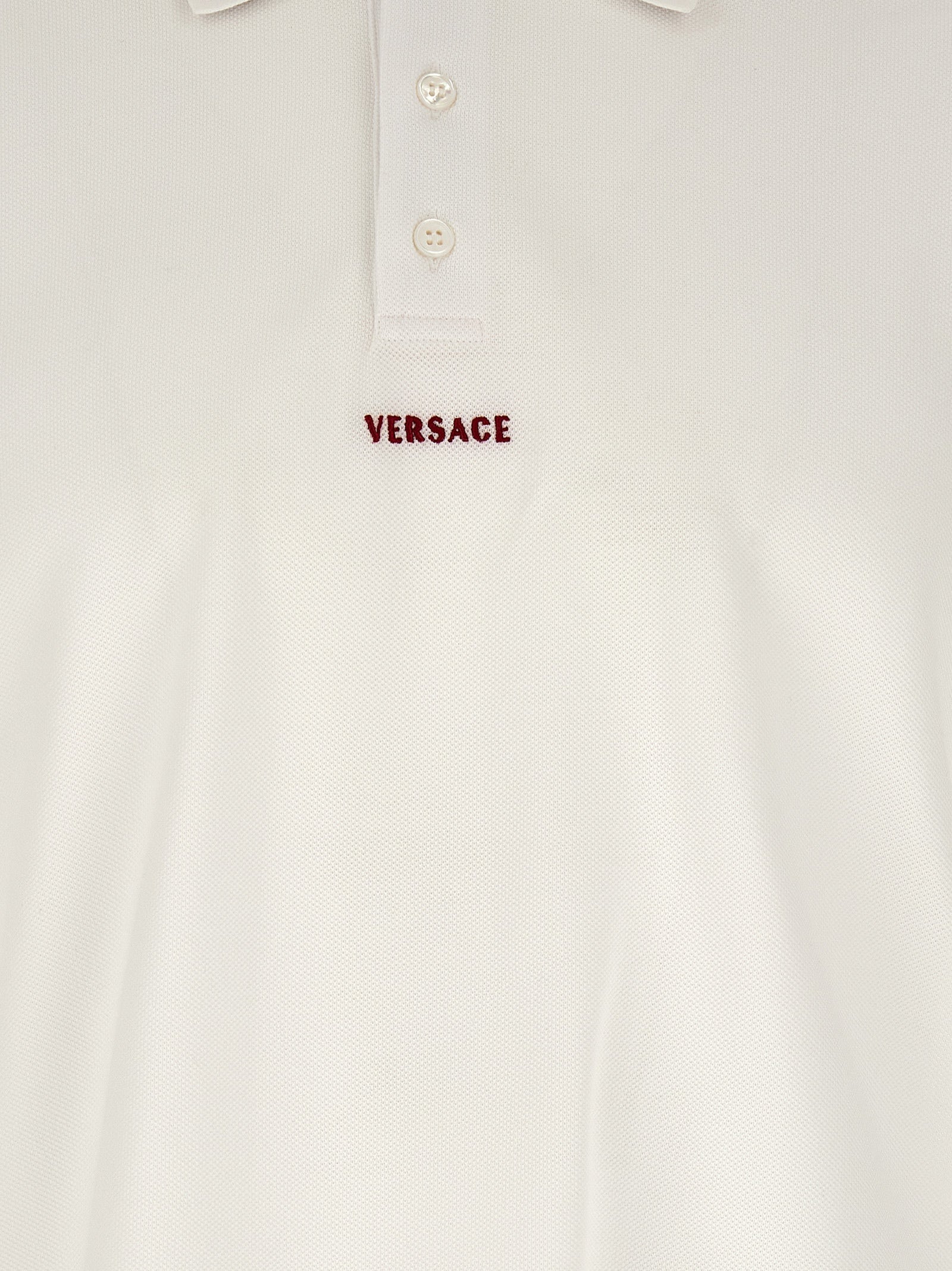 Polo Shirt by Versace for men in cotton white presents a distinguished silhouette, showcasing a sophisticated and distinguished for a truly distinguished finish.