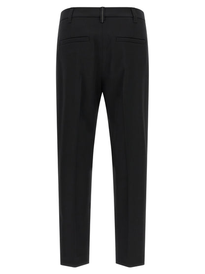 Trousers by Brunello Cucinelli for women in virgin wool black features an on trend silhouette, showcasing a sophisticated tapered-leg with a long and for an on trend finish.