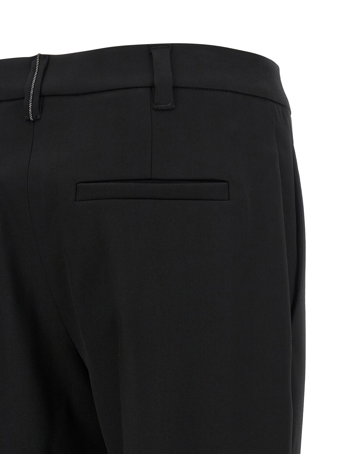 Trousers by Brunello Cucinelli for women in virgin wool black features a tailored silhouette with a tailored tapered-leg, defined by its long and a sophisticated .