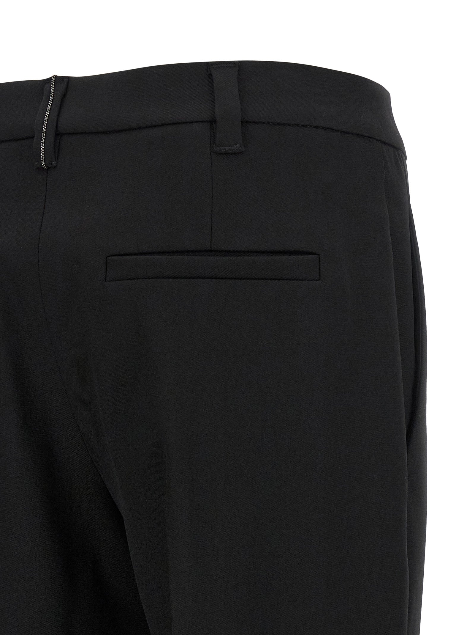 Trousers by Brunello Cucinelli for women in virgin wool black features a tailored silhouette with a tailored tapered-leg, defined by its long and a sophisticated .