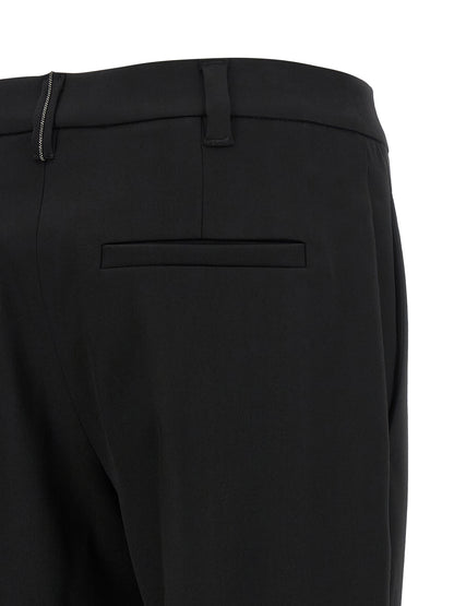Trousers by Brunello Cucinelli for women in virgin wool black features a tailored silhouette with a tailored tapered-leg, defined by its long and a sophisticated .