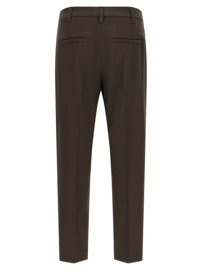 Trousers by Brunello Cucinelli for women in virgin wool brown features a tailored silhouette with a tailored tapered-leg, defined by its long and a sophisticated .