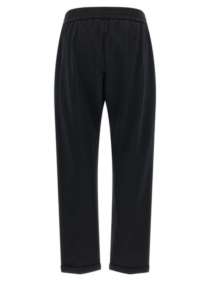 Joggers by Brunello Cucinelli for women in stretch cotton black presents a refined pantology silhouette, artfully defined by a refined pantology flared, relaxed-fit & cropped, cropped, and a sophisticated high rise.