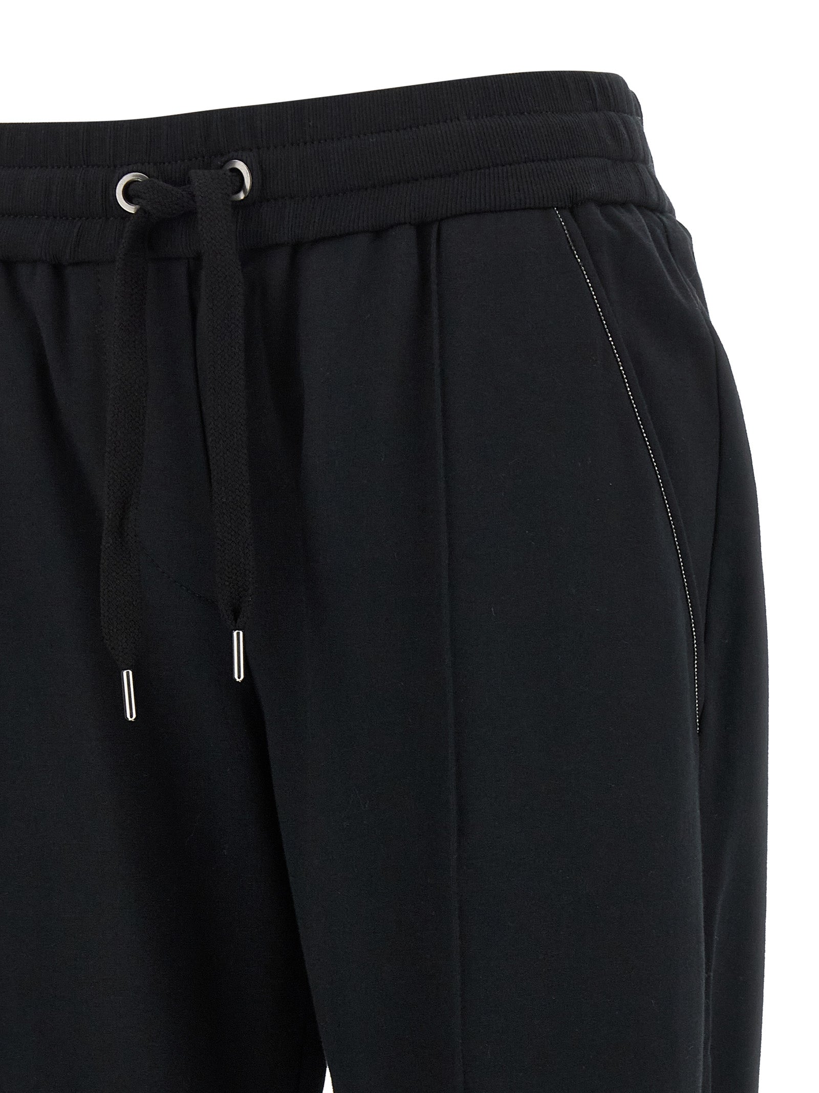 Joggers by Brunello Cucinelli for women in stretch cotton black features an refined tailoring silhouette, showcasing a premium flared, relaxed-fit & cropped with a high rise and cropped cut for a refined tailoring look.