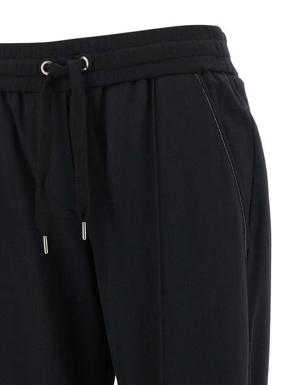 Joggers by Brunello Cucinelli for women in stretch cotton black features an refined tailoring silhouette, showcasing a premium flared, relaxed-fit & cropped with a high rise and cropped cut for a refined tailoring look.