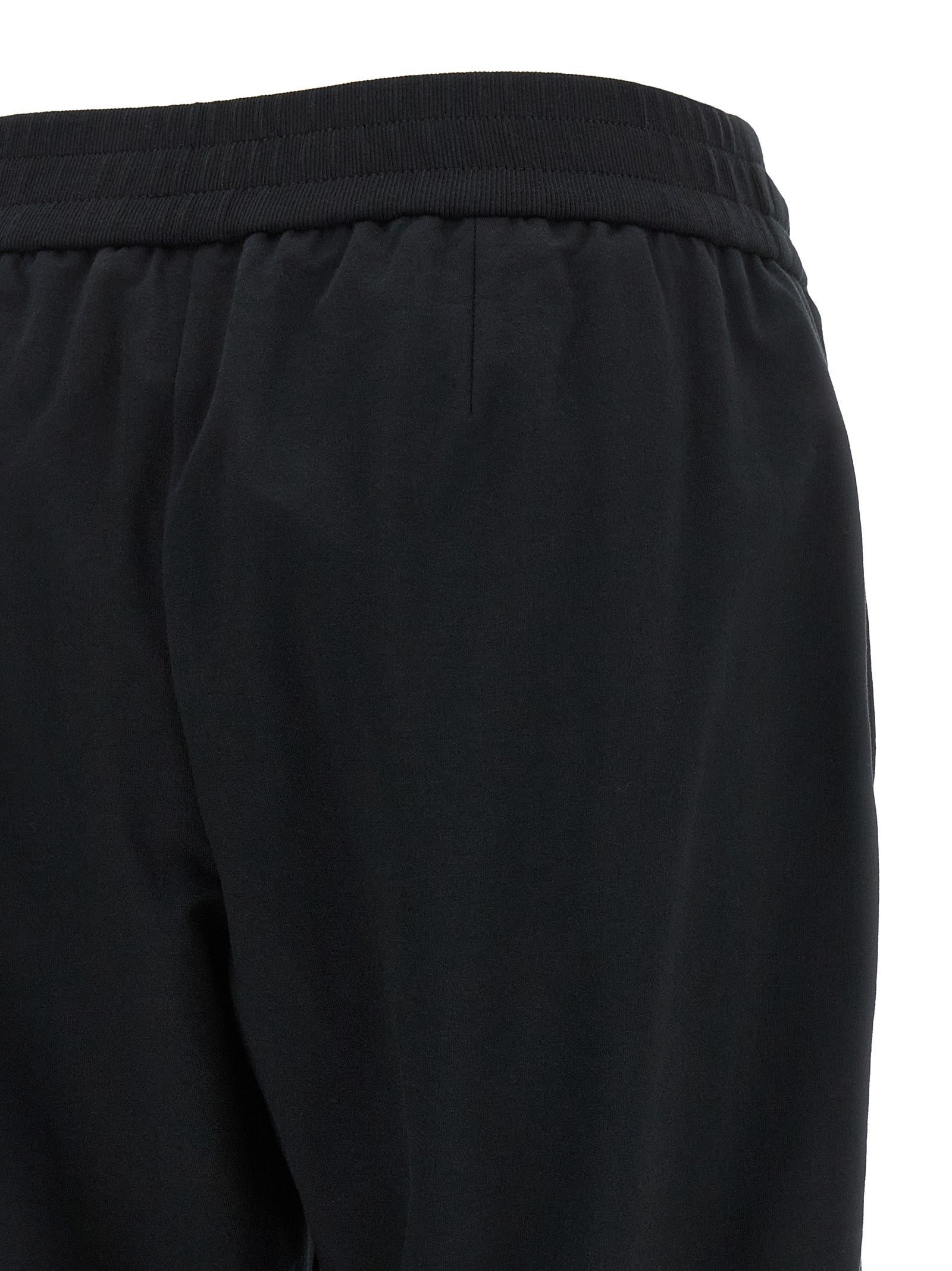 Joggers by Brunello Cucinelli for women in stretch cotton black presents a tailored silhouette, showcasing a tailored flared, relaxed-fit & cropped and cropped cut with a refined high rise for a truly tailored aesthetic.