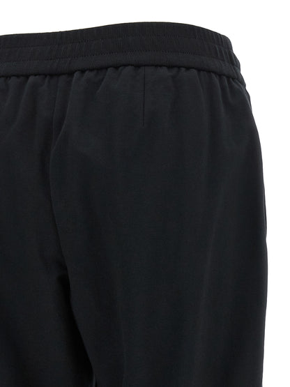 Joggers by Brunello Cucinelli for women in stretch cotton black presents a tailored silhouette, showcasing a tailored flared, relaxed-fit & cropped and cropped cut with a refined high rise for a truly tailored aesthetic.