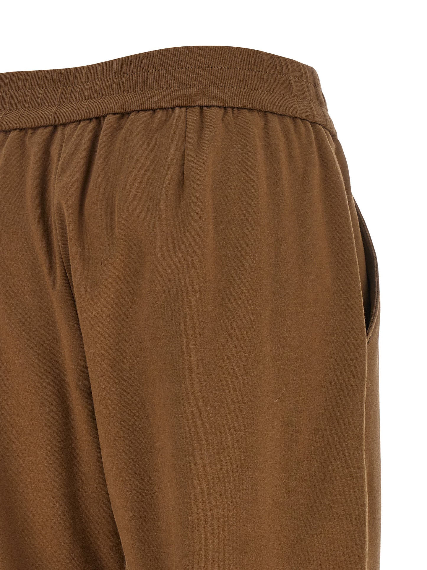 Joggers by Brunello Cucinelli for women in stretch cotton brown presents a tailored silhouette, showcasing a tailored flared & cropped and cropped cut with a refined high rise for a truly tailored aesthetic.