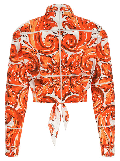 Blouse by Dolce & Gabbana for women in cotton orange & print showcases a sharp silhouette, elegantly detailed with a sharp and sharp .