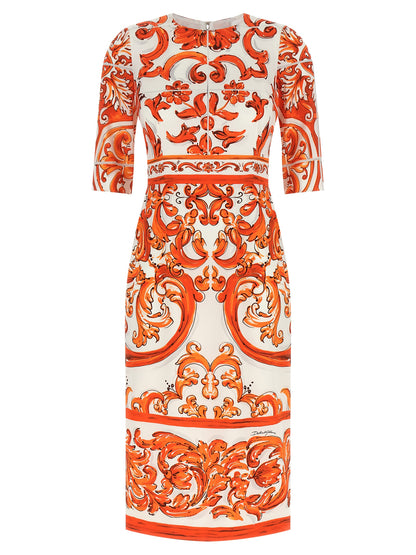 Dress by Dolce & Gabbana for women in silk orange & print features an cute silhouette, detailed with a three-quarter-sleeve and crew split neckline that elegantly flows into a cute midi.