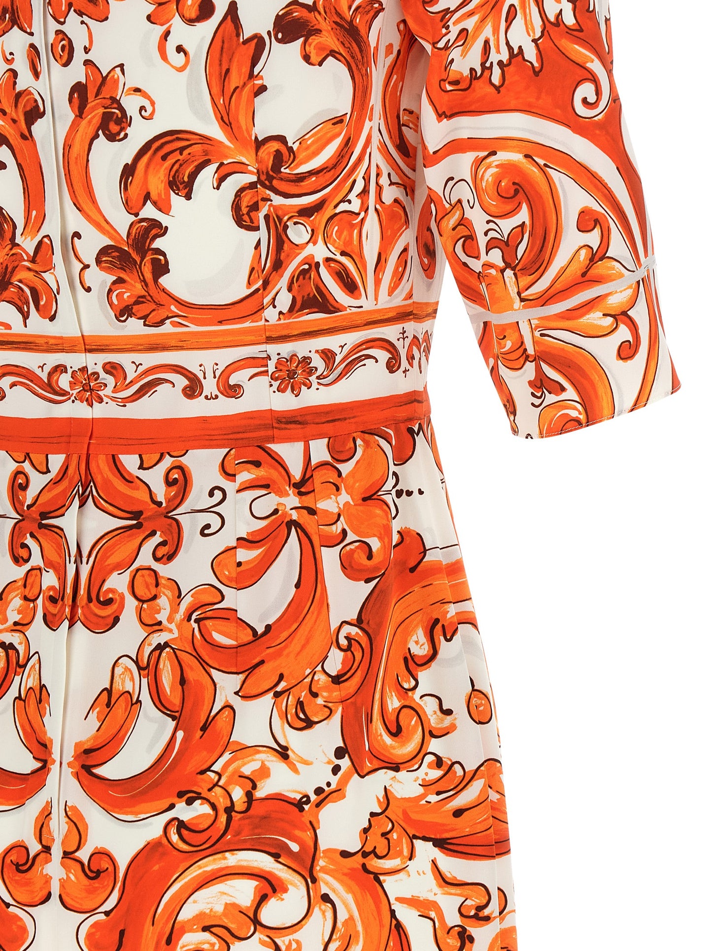 Dress by Dolce & Gabbana for women in silk orange & print showcases a striking silhouette, elegantly detailed with a , refined , and a striking midi for a striking finish.