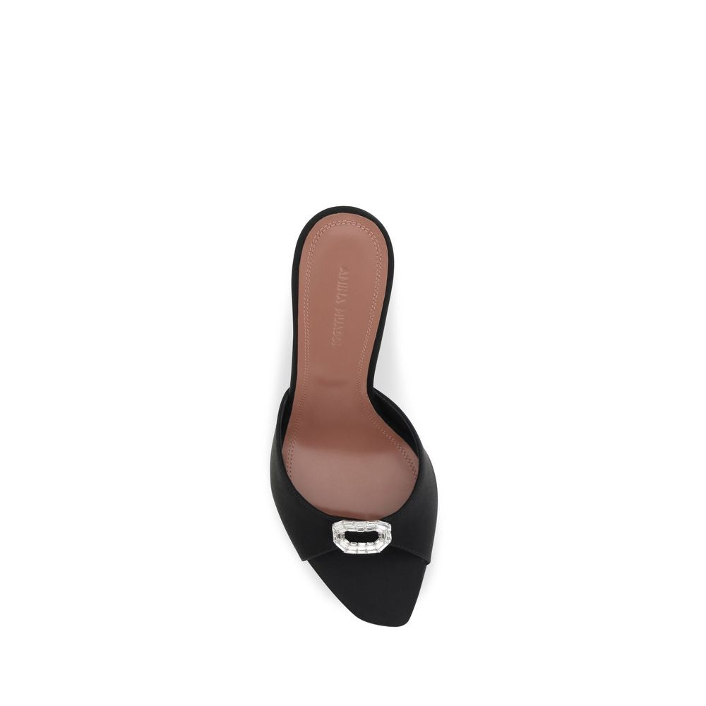 Stiletto Mules Sandals by Amina Muaddi for women in silk satin & crystal black features an statuesque Camelia Women's Silk Satin & Crystal Stiletto Mules Sandals silhouette with a refined stiletto and elegant open toe style.