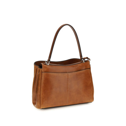 This Handbag by Balenciaga for women in lambskin leather and brown & silver presents a sculptural silhouette featuring a secure , ample built-in-compartments & external-pockets, and versatile shoulder-strap & handle for a sculptural finish.