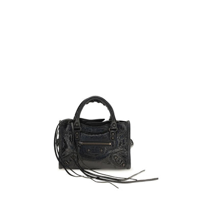 Compact Handbag by Balenciaga for women in lambskin leather black & signature features a signature silhouette, showcasing a secure zipper and signature with versatile shoulder-strap, adjustable-strap & handle for a sophisticated look.