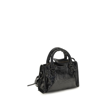 This Compact Handbag by Balenciaga for women in lambskin leather and black & signature presents a sculptural silhouette featuring a secure zipper, ample , and versatile shoulder-strap, adjustable-strap & handle for a sculptural finish.