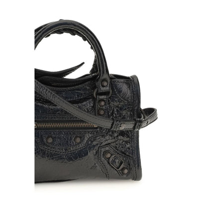 Compact Handbag by Balenciaga for women in lambskin leather black & signature features an refined silhouette, showcasing a secure zipper, ample , and versatile shoulder-strap, adjustable-strap & handle for a sophisticated refined aesthetic.