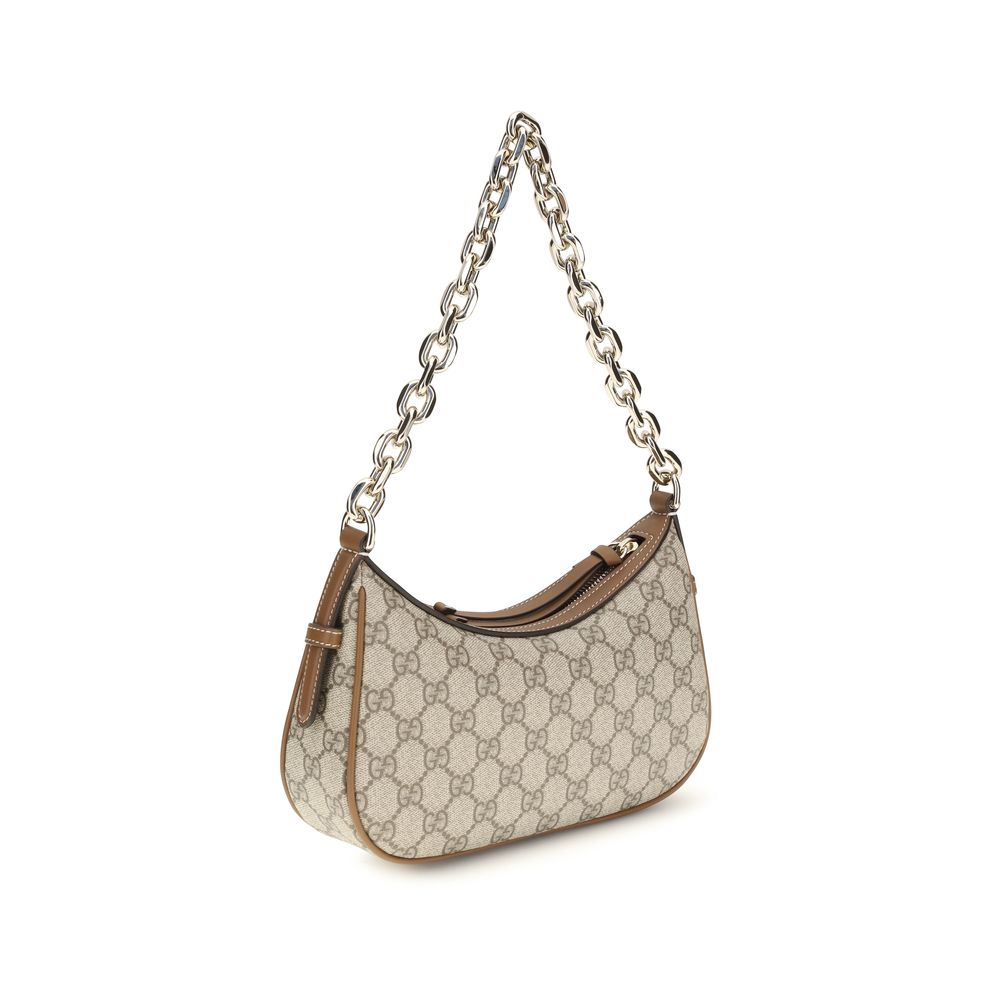 Small Shoulder Handbag by Gucci for women in leather beige, gold & monogram features an refined silhouette, showcasing a secure zipper, ample , and versatile shoulder-strap for a sophisticated refined aesthetic.