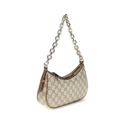 This Small Shoulder Handbag by Gucci for women in leather and beige, gold & monogram presents a sculptural silhouette featuring a secure zipper, ample , and versatile shoulder-strap for a sculptural finish.