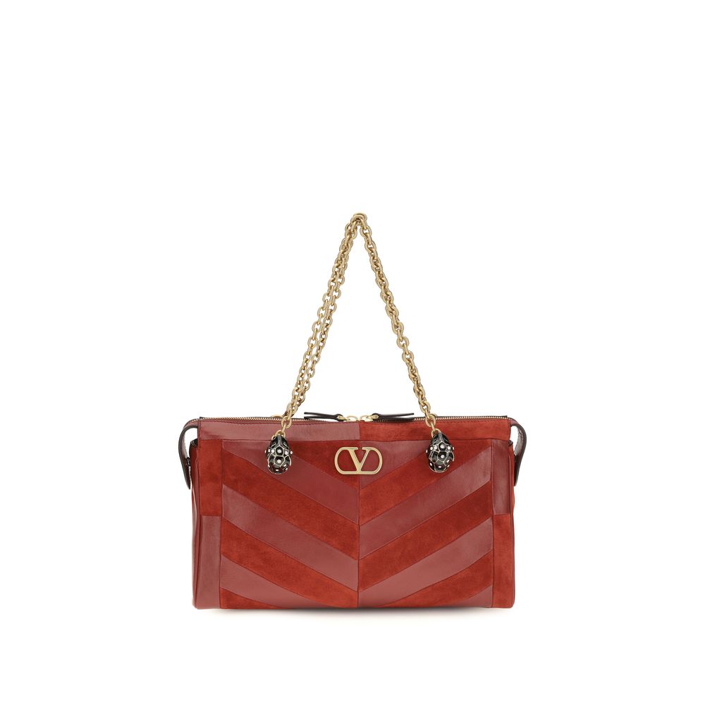 Medium Shoulder Bag by Valentino Garavani for women in bio-acetate & bos taurus calf leather gold, multicolor, chevron, signature & patchwork features an effortlessly chic silhouette with a secure zipper, ample single-compartment, and versatile shoulder-strap, adjustable-strap & handle for effortlessly chic everyday luxury.