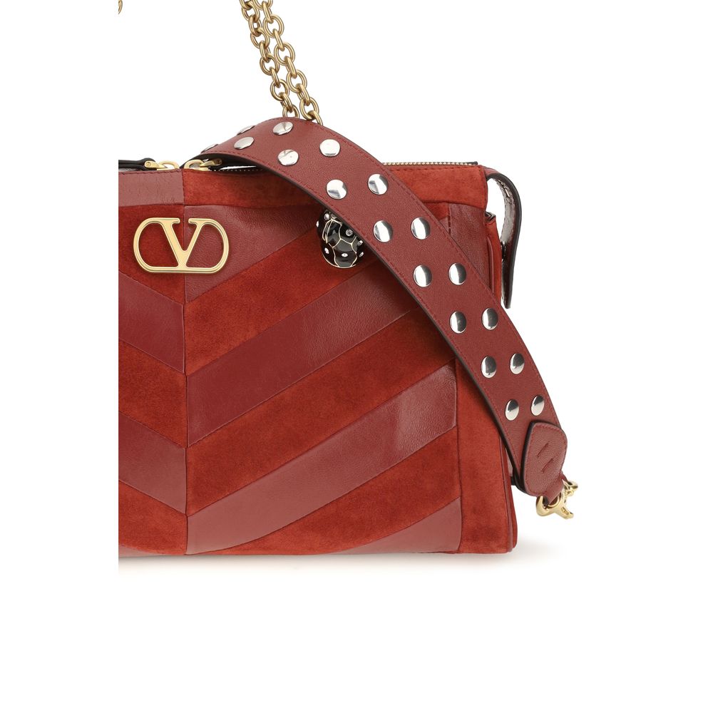 Medium Shoulder Bag by Valentino Garavani for women in bio-acetate & bos taurus calf leather gold, multicolor, chevron, signature & patchwork presents a versatile silhouette, showcasing a secure zipper and versatile single-compartment with versatile shoulder-strap, adjustable-strap & handle for a sophisticated look.