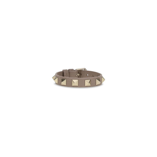Bracelet by Valentino Garavani for women in bos taurus calf leather gray & gold showcases a cosmopolitan silhouette, artfully capturing the essence of the cosmopolitan Rockstud Women's Bos Taurus Calfskin Leather Bracelet with a cosmopolitan .