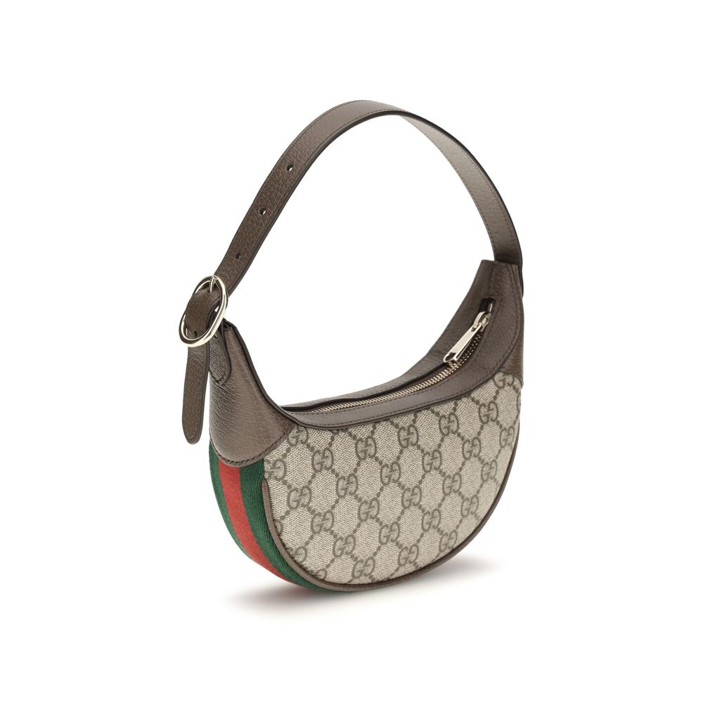 This Small Shoulder Handbag by Gucci for women in leather and beige, gold, signature, monogram & striped presents a sculptural silhouette featuring a secure zipper, ample cardholder, and versatile shoulder-strap & handle for a sculptural finish.
