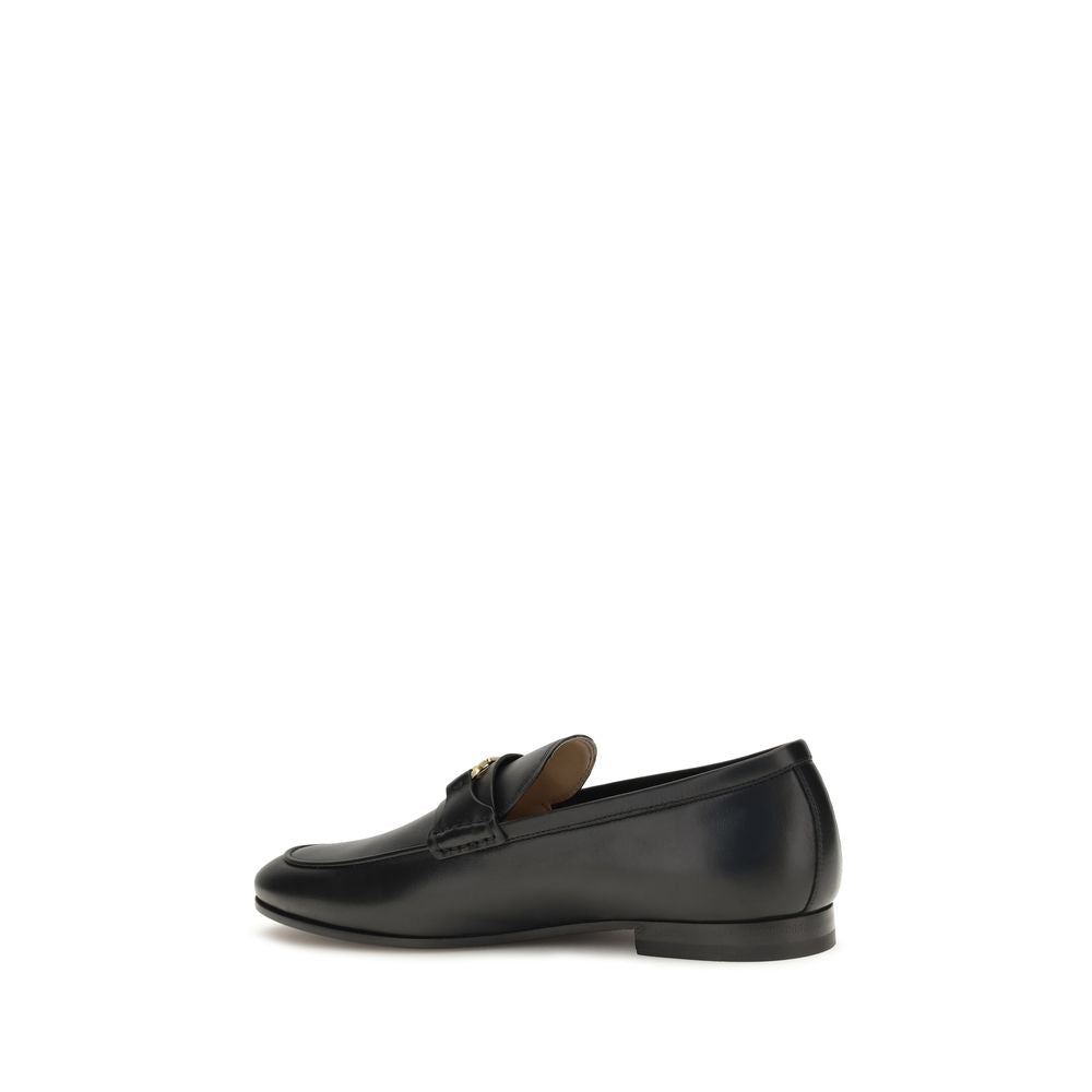 Loafer Slip-On Shoes by Valentino Garavani for men in bos taurus calf leather black, gold & signature showcases a impeccable silhouette as V Logo Men's Bos Taurus Calf Leather Loafer Slip-On Shoes, artfully designed with a impeccable and refined for a impeccable finish.